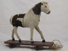 A child's pull along toy pony