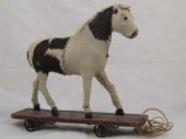 A child's pull along toy pony