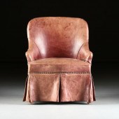A CHILD'S RED LEATHER UPHOLSTE