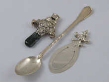 A child's silver rattle with two