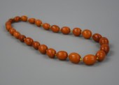 A CHINESE 27 BEED BEESWAX NECK