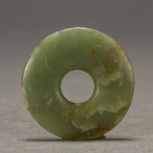 A CHINESE ARCHAISTIC JADE DISC