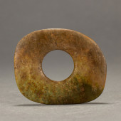 A CHINESE ARCHAISTIC JADE DISC