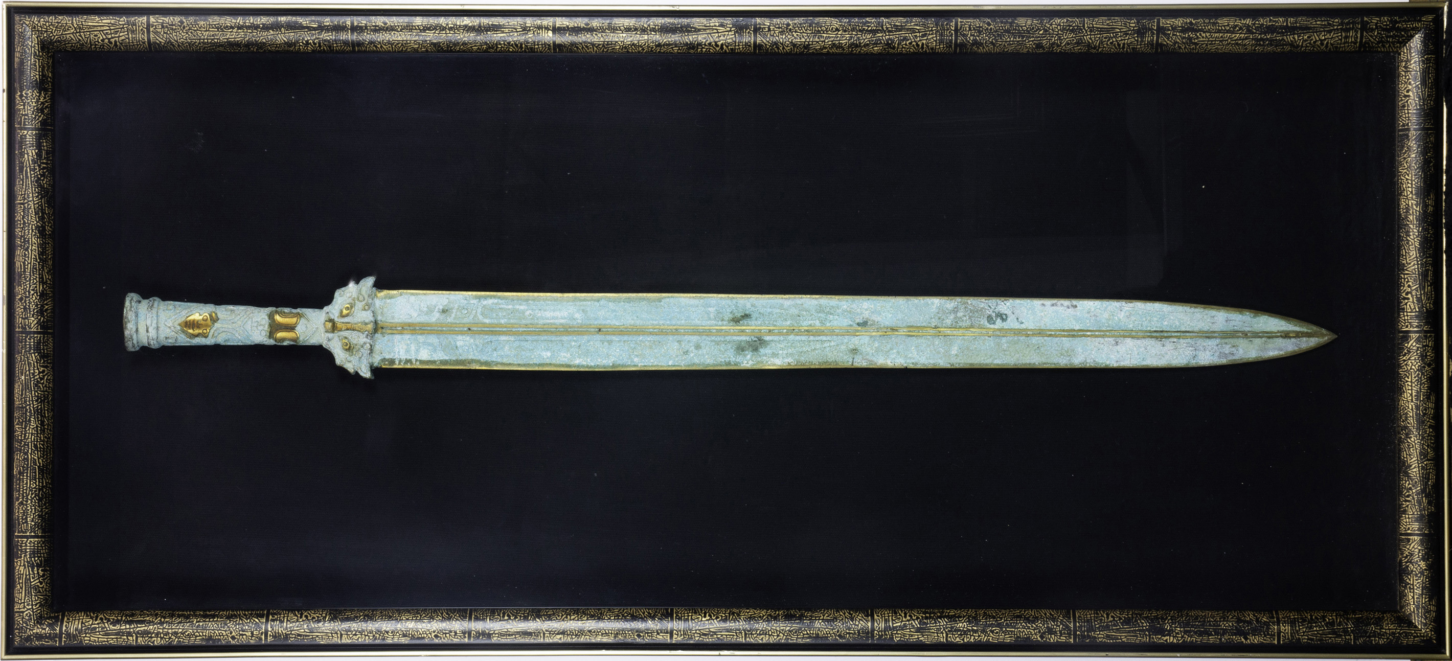 A CHINESE ARCHAISTIC STYLE SWORD IN