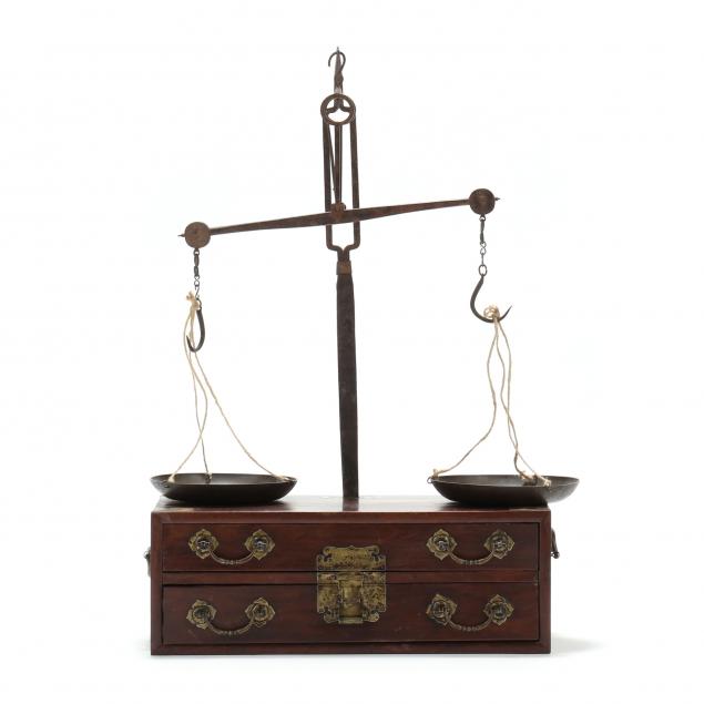 A CHINESE BALANCE SCALE ON CHEST 