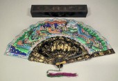A Chinese black lacquered fan