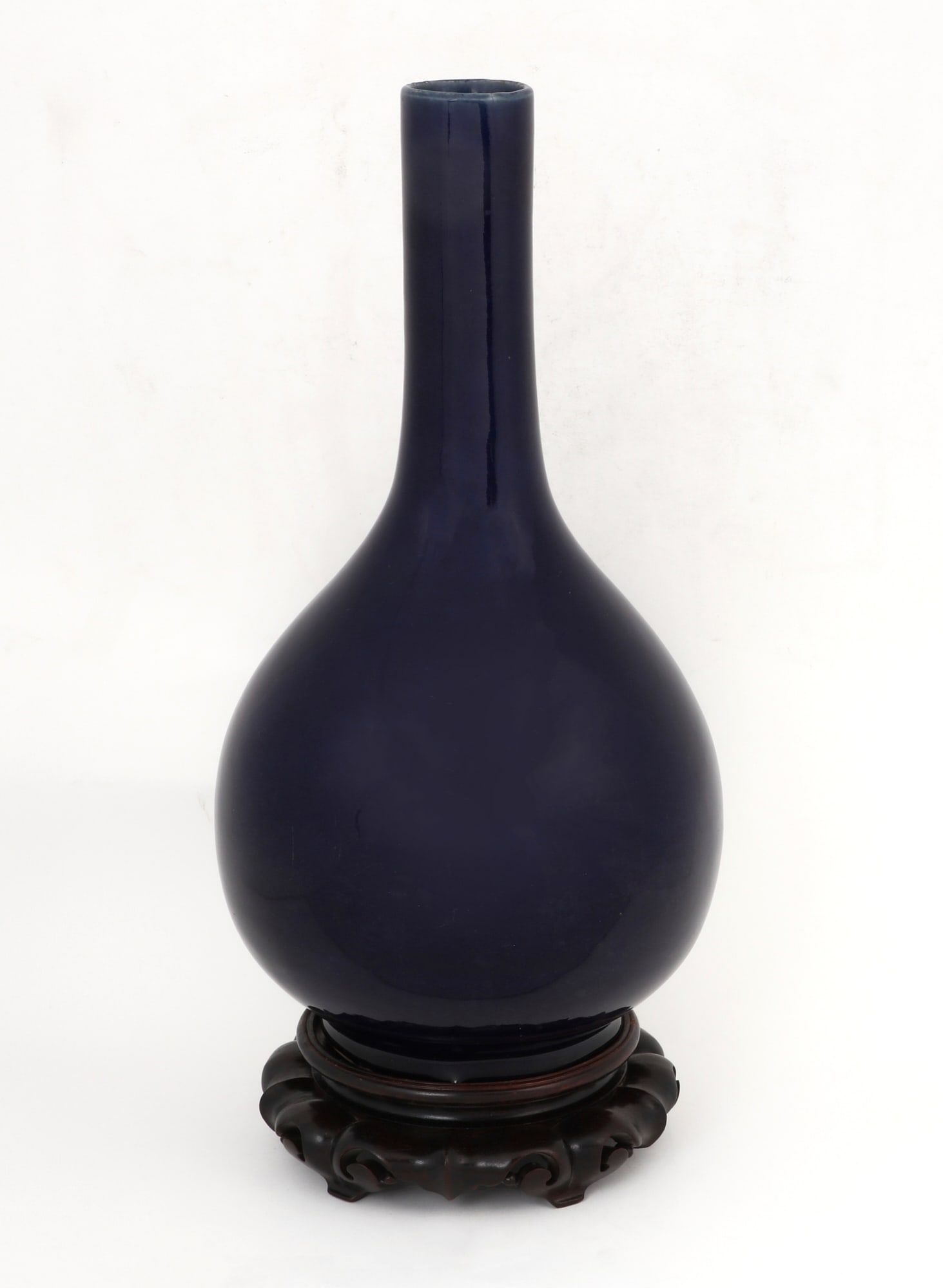 A CHINESE BLUE GLAZED STICK NECK