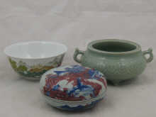 A Chinese bowl and cover with red