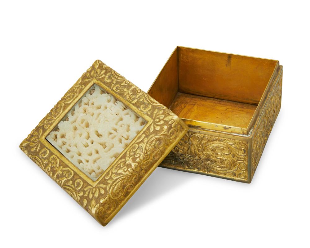 A CHINESE BRASS AND CARVED JADE