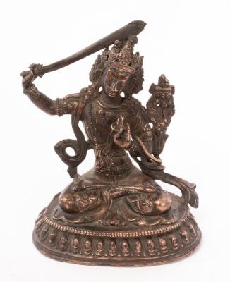 A Chinese brass figure of