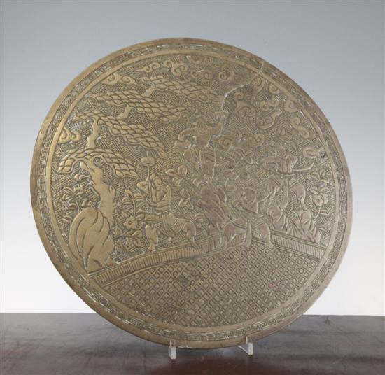 A Chinese bronze circular plaque