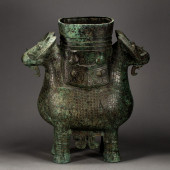 A CHINESE BRONZE DOUBLE HEADS