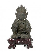 A CHINESE BRONZE FIGURE OF A S