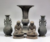 A Chinese bronze Gu shaped vas