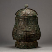 A CHINESE BRONZE LIDDED ZUN<br