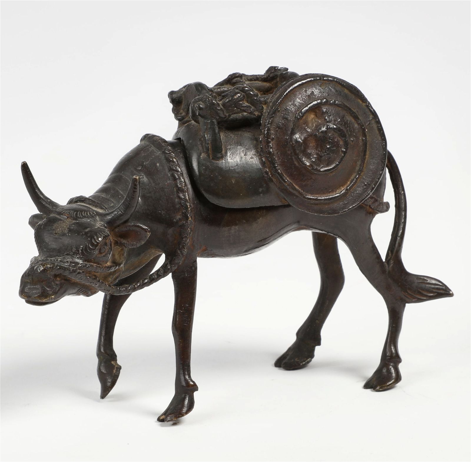 A CHINESE BRONZE OX FORM CENSERA
