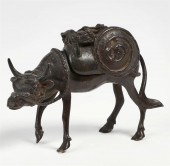 A CHINESE BRONZE OX FORM CENSE