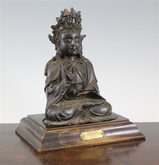 A Chinese bronze seated figure of a