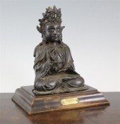 A Chinese bronze seated figure