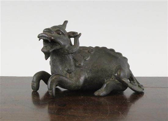 A Chinese bronze weight in the form