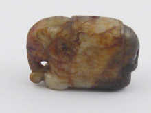 A Chinese brown jade pendant carved