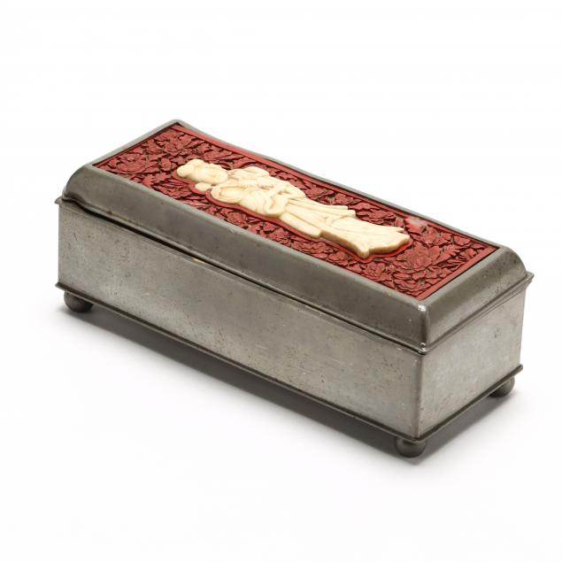 A CHINESE CARVED CINNABAR