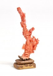 A CHINESE CARVED CORAL FIGUREA