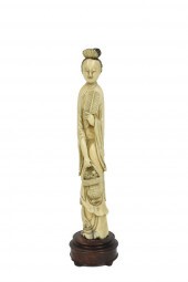 A CHINESE CARVED FIGURE OF A L