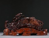 A CHINESE CARVED HARDWOOD DECO