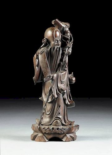 A CHINESE CARVED HARDWOOD FIGURE OF