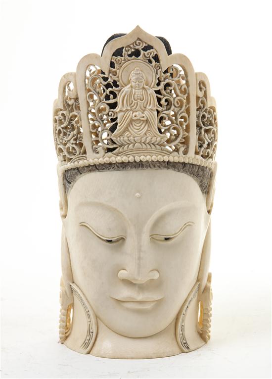 * A Chinese Carved Ivory Buddha