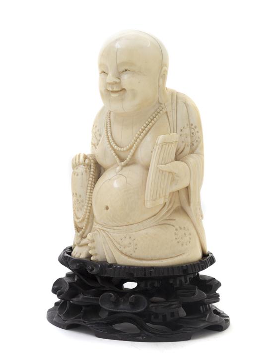 A Chinese Carved Ivory Figure of