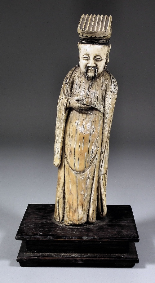 A Chinese carved ivory figure of