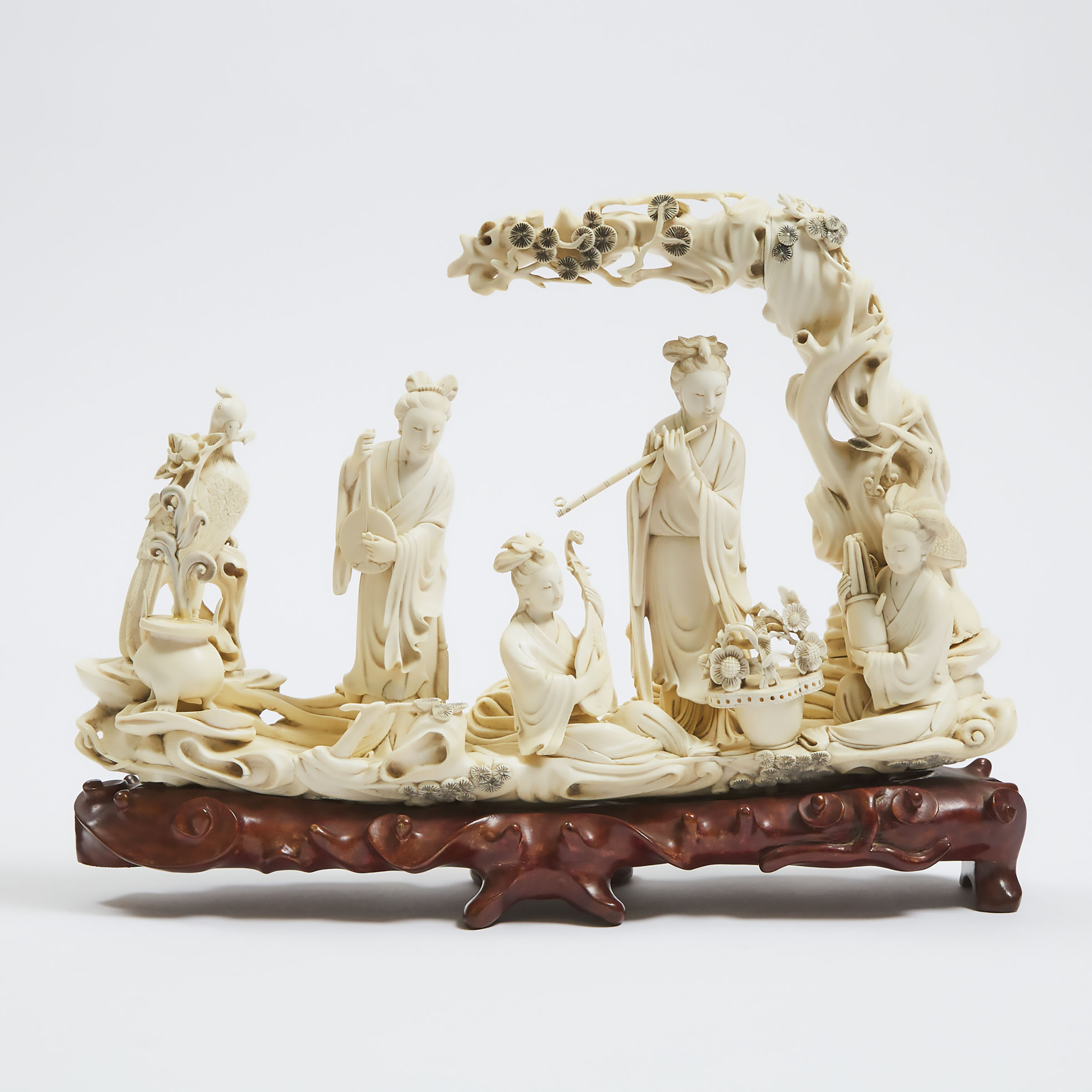A Chinese Carved Ivory Group of