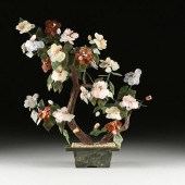 A CHINESE CARVED JADE AND HARD