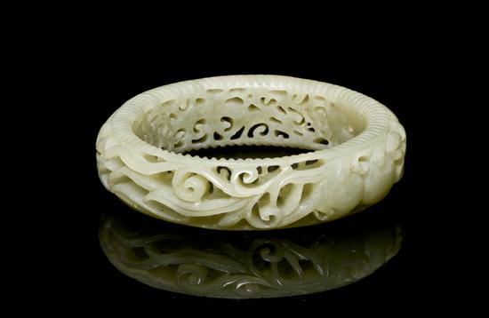 A Chinese Carved Jade Bangle of