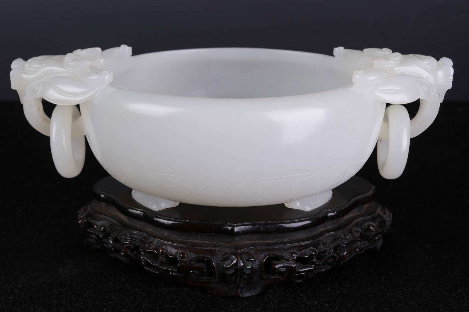 A CHINESE CARVED JADE BRUSH