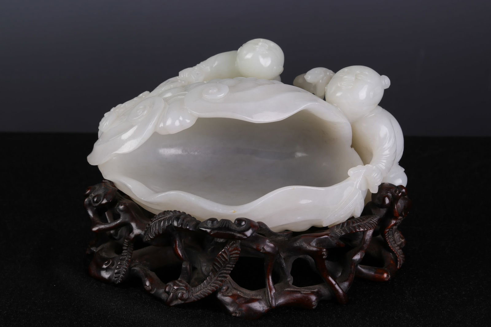 A CHINESE CARVED JADE BRUSH