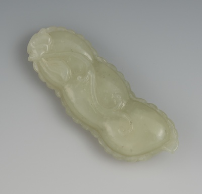 A Chinese Carved Jade Croton Bean