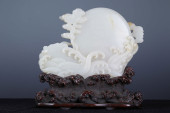 A CHINESE CARVED JADE DECORATI