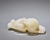 A CHINESE CARVED JADE DECORATI