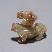 A CHINESE CARVED JADE DECORATI