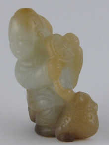A Chinese carved jade figure of boy