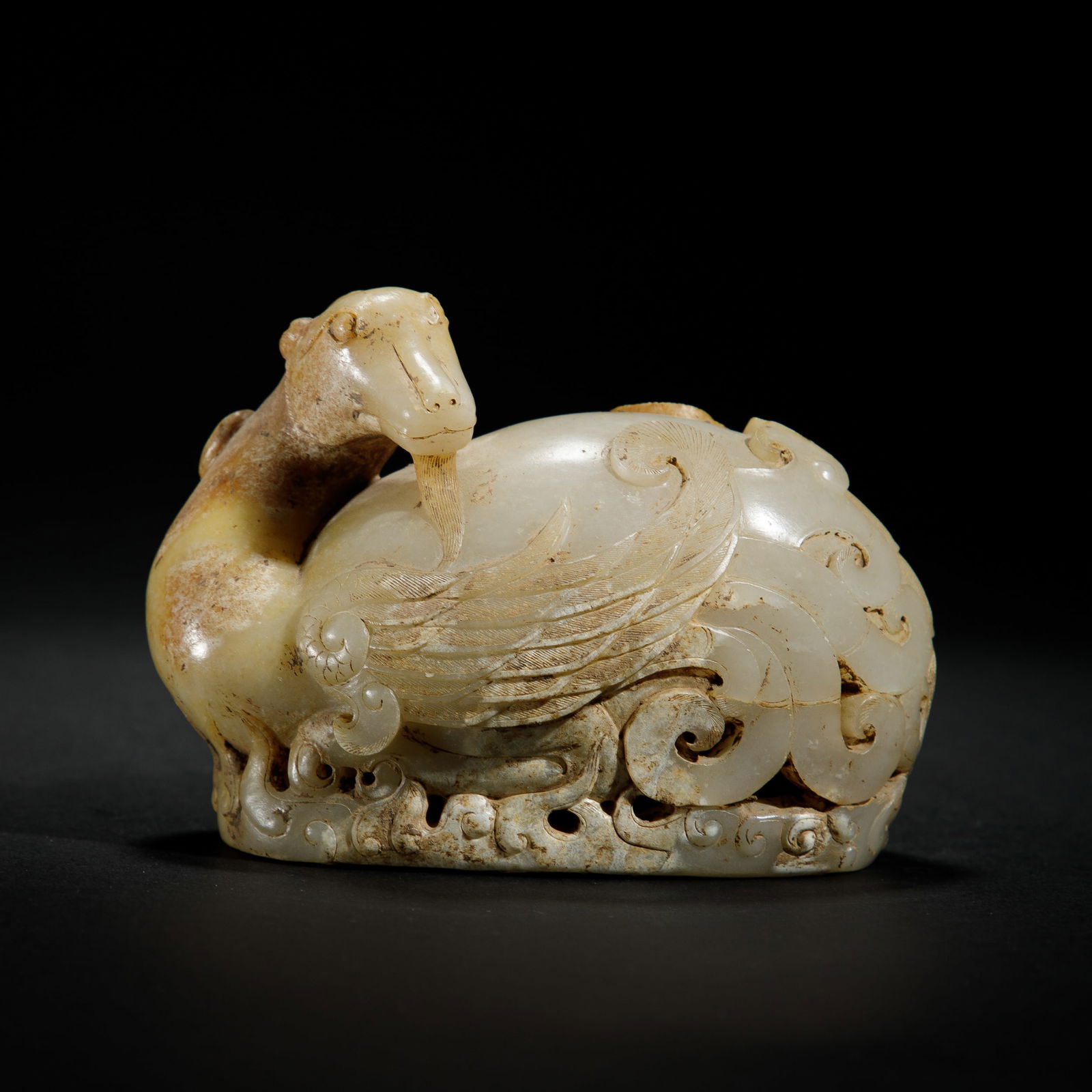 A CHINESE CARVED JADE MYTHICAL