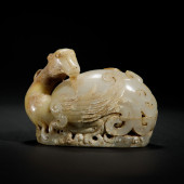 A CHINESE CARVED JADE MYTHICAL