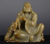 A CHINESE CARVED JADE SEATED F