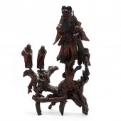 A CHINESE CARVED ROOTWOOD SCUL