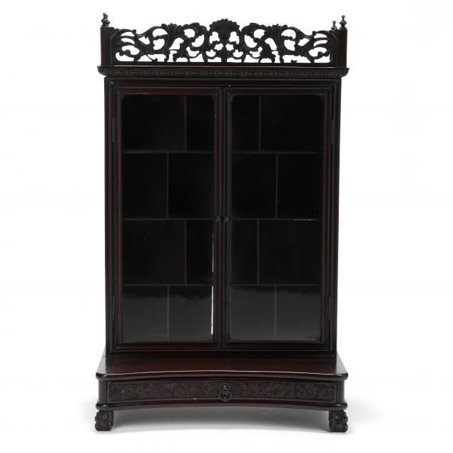A CHINESE CARVED ROSEWOOD