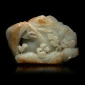 A Chinese Carved Russet and Pa