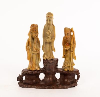 A Chinese carved soapstone group of